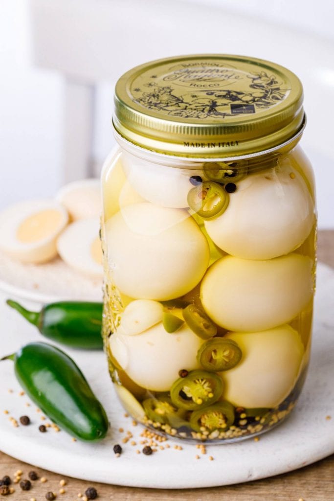 A bowl of spicy jalapeno pickled eggs