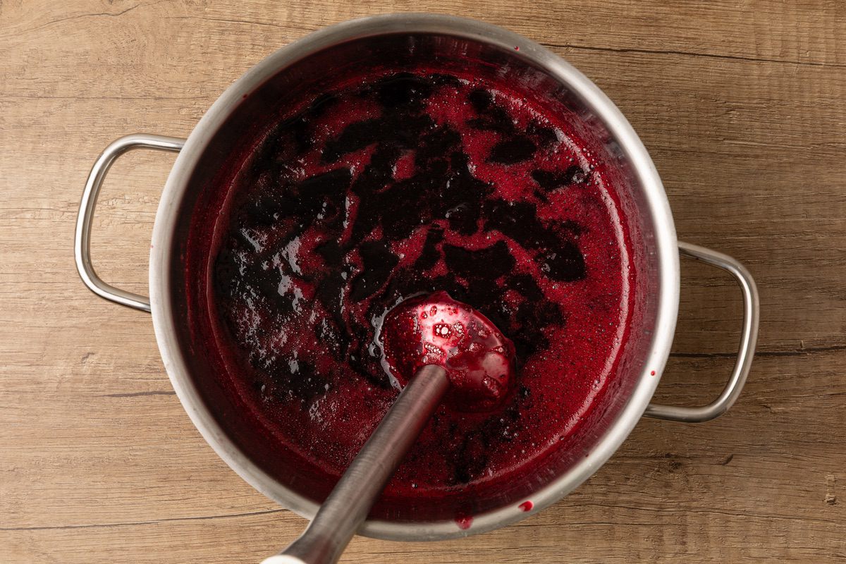 blending cherry jam with immersion blender